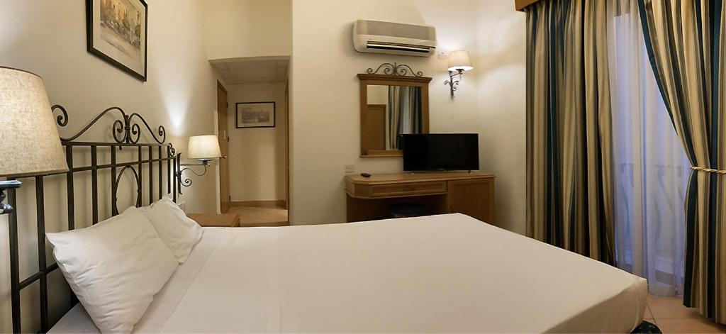 Postel nebo postele na pokoji v ubytování Hotel Kennedy Nova