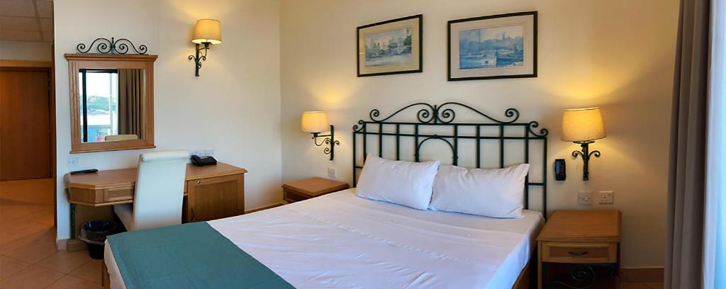 Postel nebo postele na pokoji v ubytování Hotel Kennedy Nova