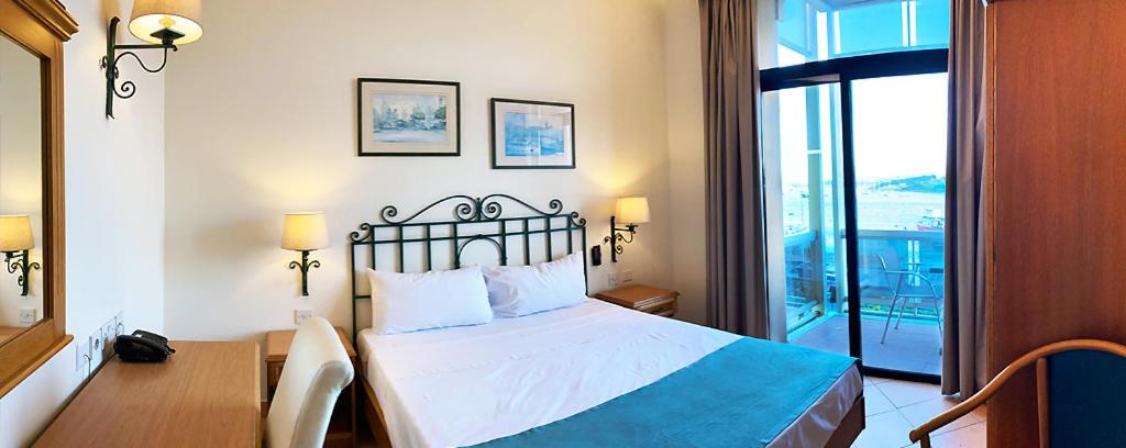Postel nebo postele na pokoji v ubytování Hotel Kennedy Nova