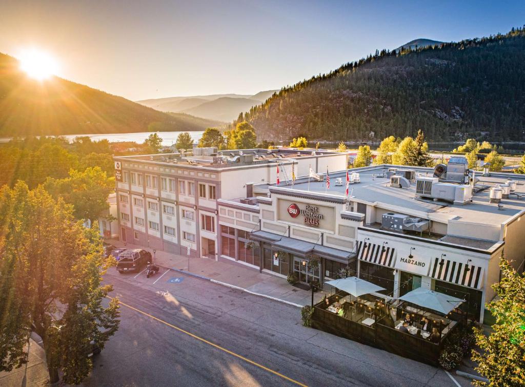 an aerial view of a building with the sun setting at Best Western Plus Baker Street Inn in Nelson