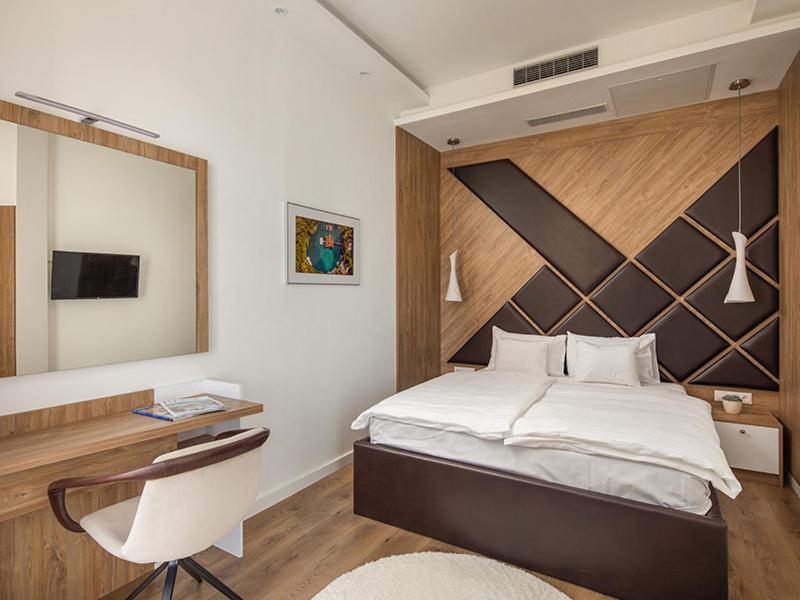 Posteľ alebo postele v izbe v ubytovaní Hotel Carbona Spa Residence Apartmanok