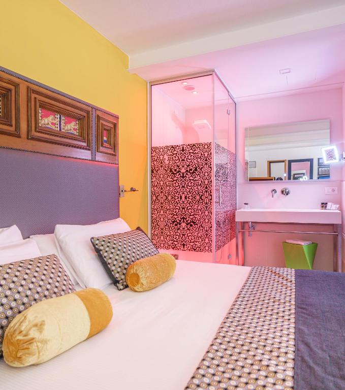 Posteľ alebo postele v izbe v ubytovaní Hotel Lampara