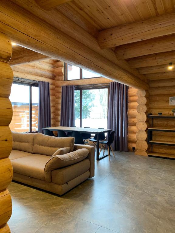 a living room with a couch and a table at 4REST ZRUB in Tukhlya