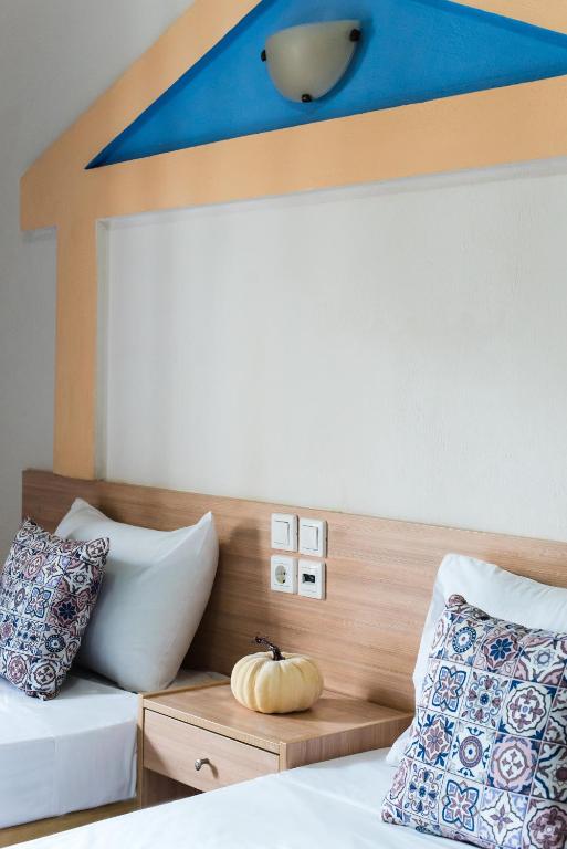 Postel nebo postele na pokoji v ubytování Ilios Malia Hotel Resort