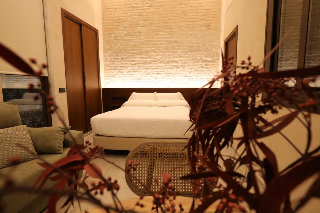 Postel nebo postele na pokoji v ubytování Casa Señorial del Siglo XVIII