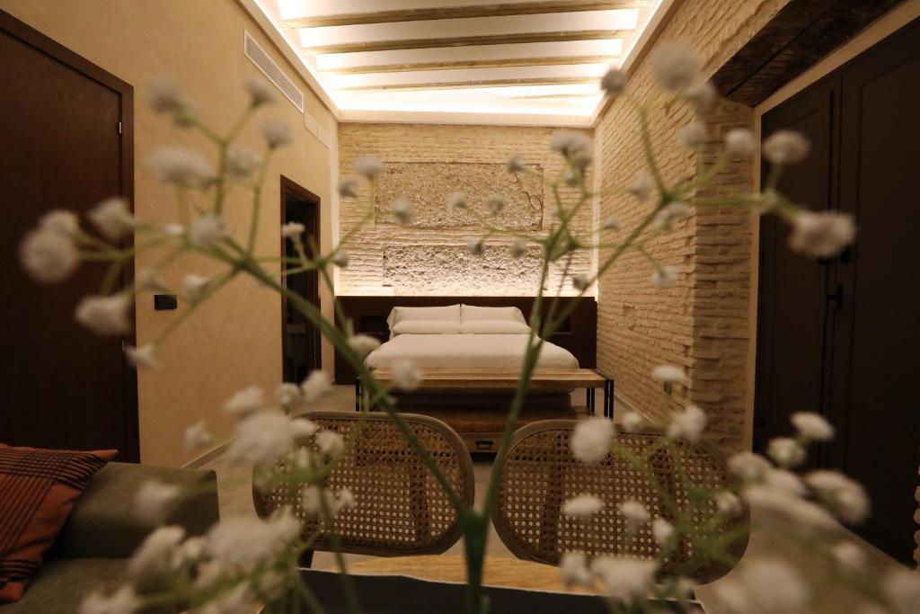 Postel nebo postele na pokoji v ubytování Casa Señorial del Siglo XVIII