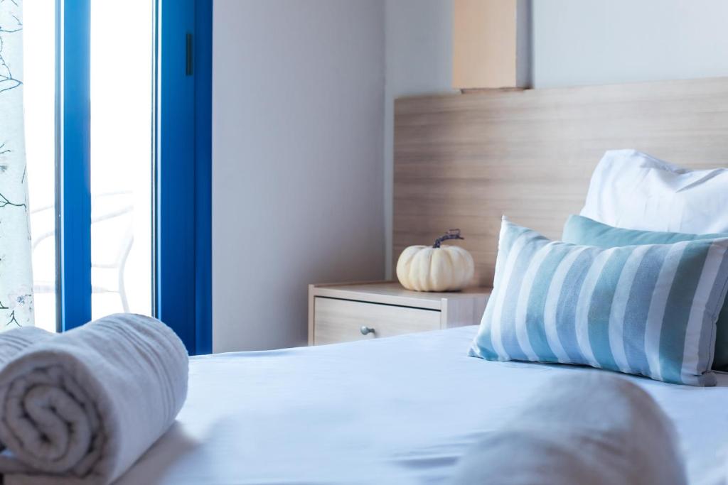 Postel nebo postele na pokoji v ubytování Ilios Malia Hotel Resort