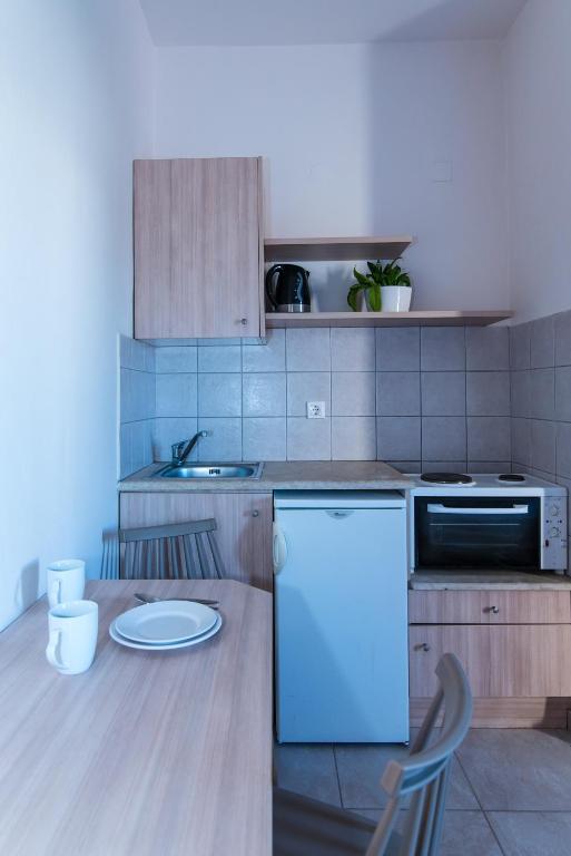 Kuchyň nebo kuchyňský kout v ubytování Ilios Malia Hotel Resort