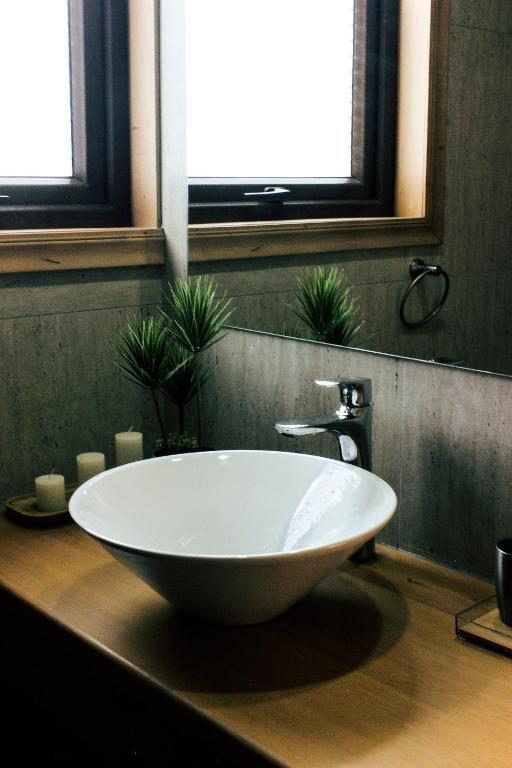 a large white bowl sink on a counter in a bathroom at Cabañas Arrayanes de Huillinco en Chiloé in Chonchi