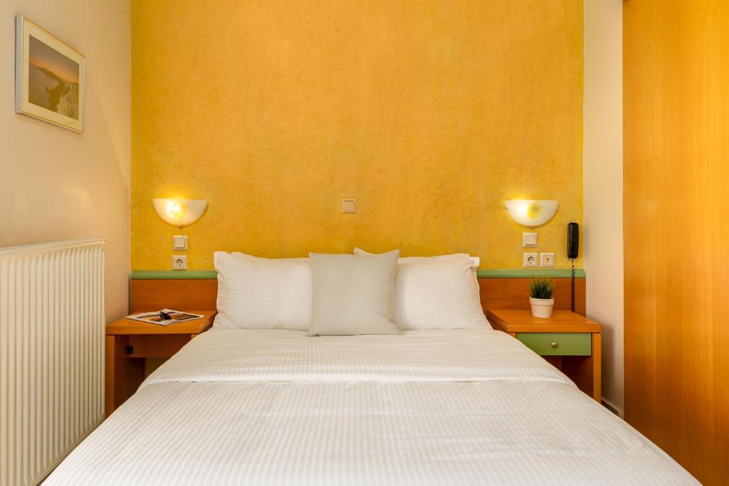 Postel nebo postele na pokoji v ubytování Dias Hotel Platamon