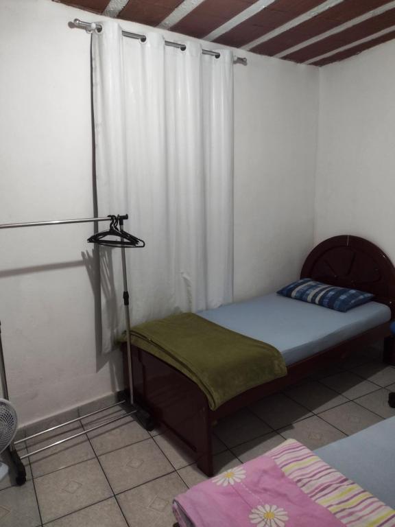 Postel nebo postele na pokoji v ubytování Hospedagem Progresso
