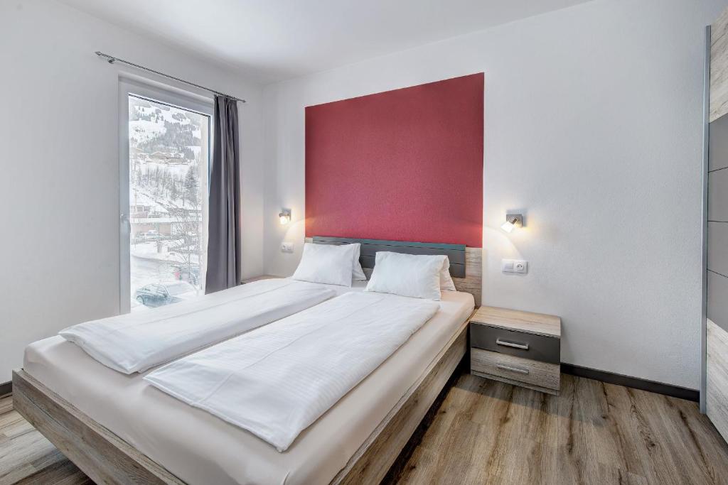 Postel nebo postele na pokoji v ubytování LoriVita Residenz Saalbach
