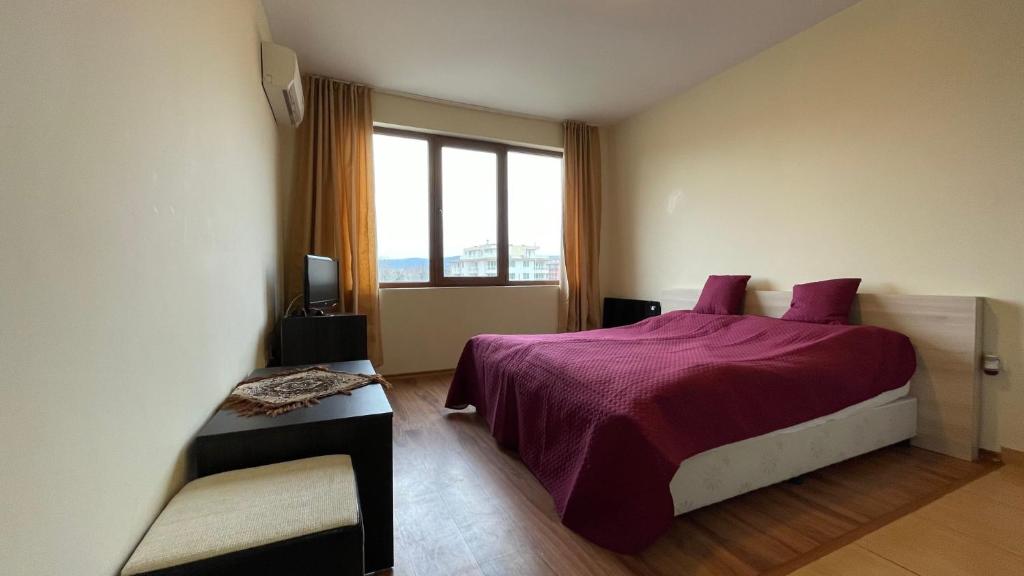A bed or beds in a room at SUMMER BREEZE 406 Studio Sunny Beach