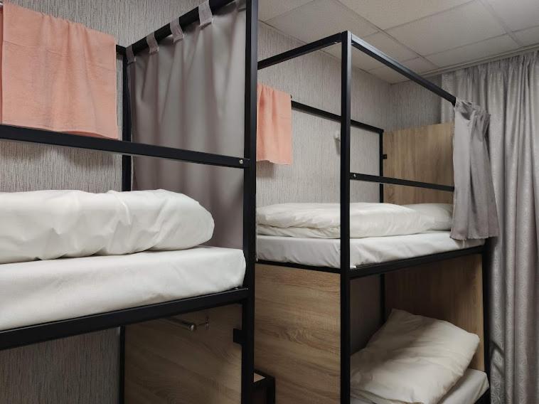 Postel nebo postele na pokoji v ubytování STAR CITY Hostel