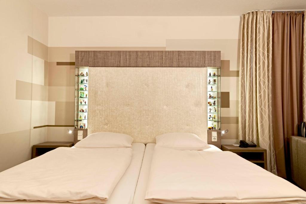 Postel nebo postele na pokoji v ubytování Ringhotel Reubel