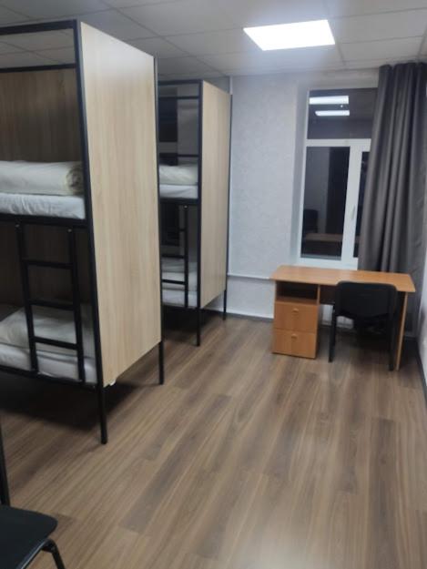 Postel nebo postele na pokoji v ubytování STAR CITY Hostel