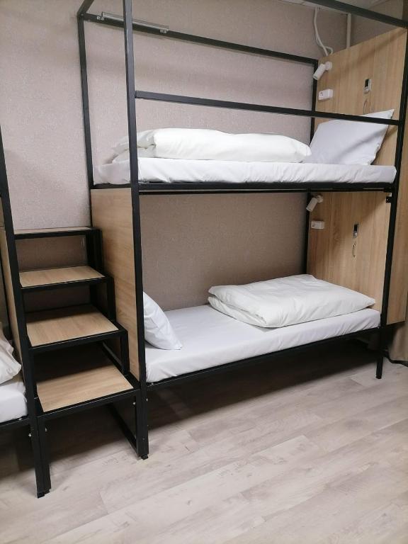 Postel nebo postele na pokoji v ubytování STAR CITY Hostel