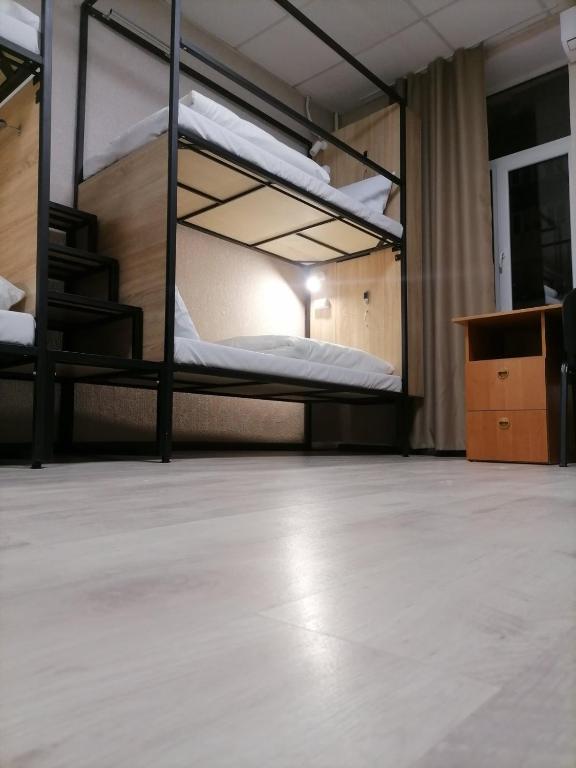 Postel nebo postele na pokoji v ubytování STAR CITY Hostel