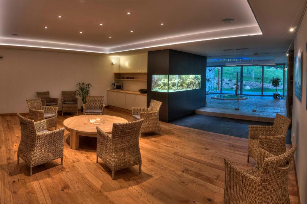 a living room with a table and chairs at Statek Samsara in Blansko