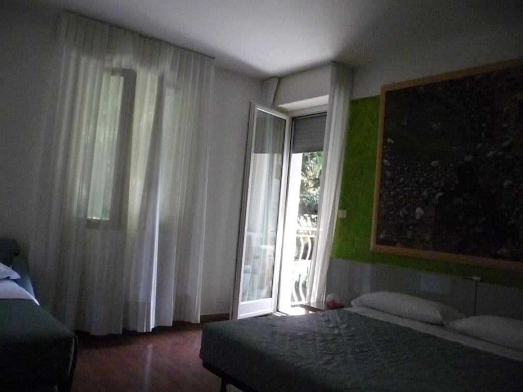 Postel nebo postele na pokoji v ubytování Hotel Luna