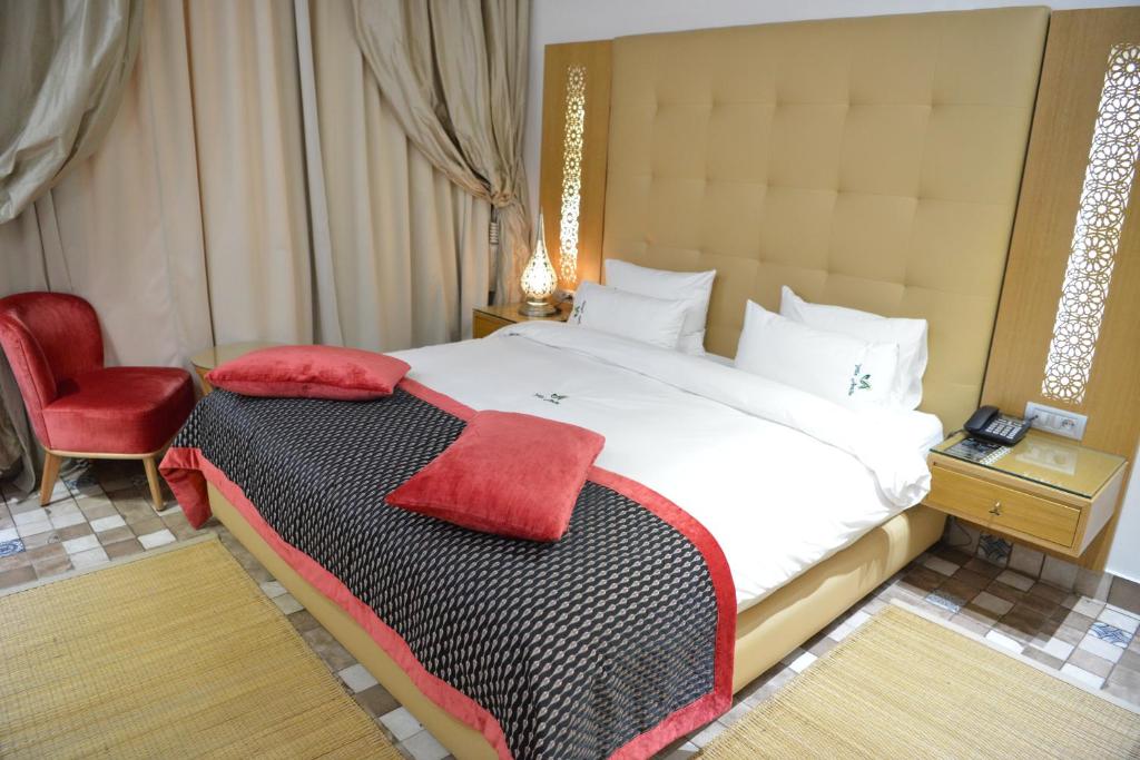 Postel nebo postele na pokoji v ubytování Aralia Boutique Hôtel