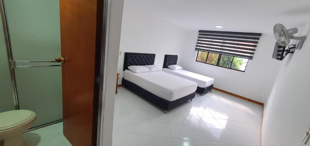 Postel nebo postele na pokoji v ubytování Hotel Picasso 70