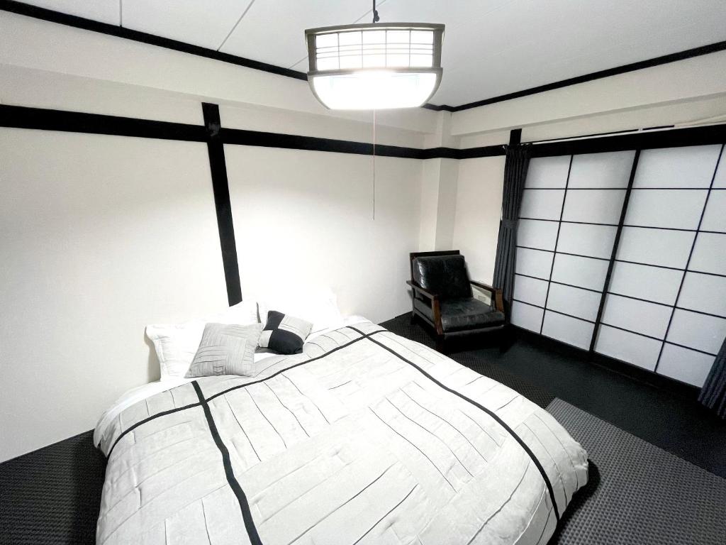 Postel nebo postele na pokoji v ubytování Nozawa Onsen BASECAMP