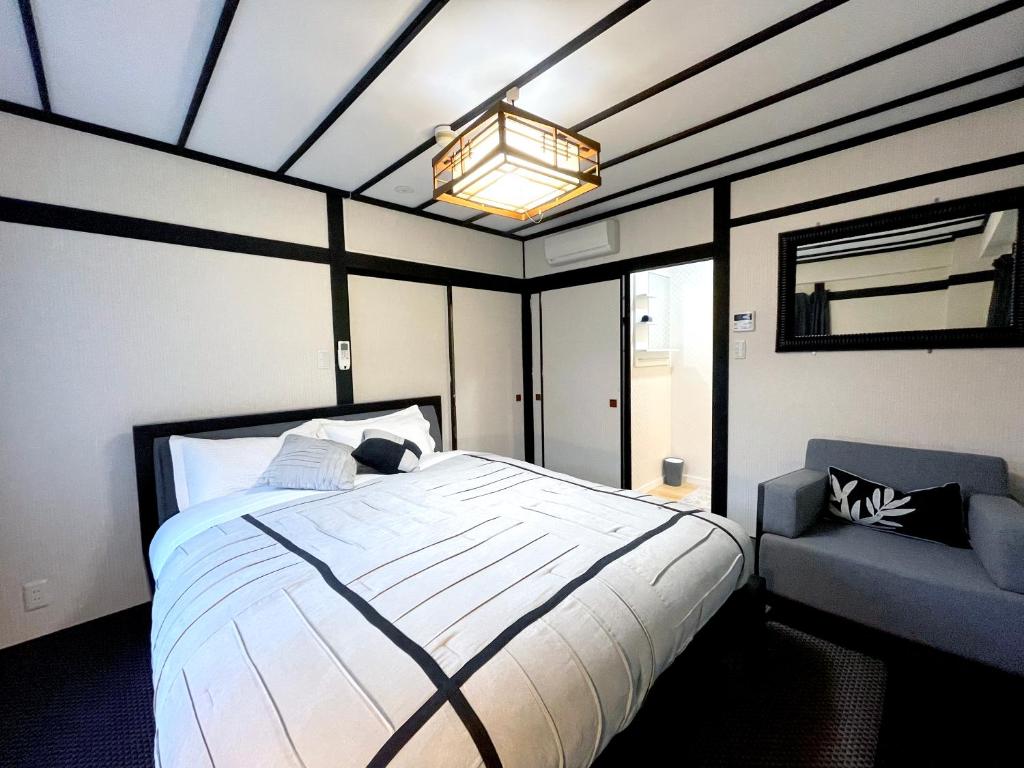 Postel nebo postele na pokoji v ubytování Nozawa Onsen BASECAMP