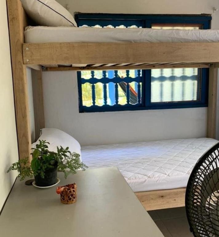 a room with two bunk beds and a table at Casa Horizontes in San Carlos