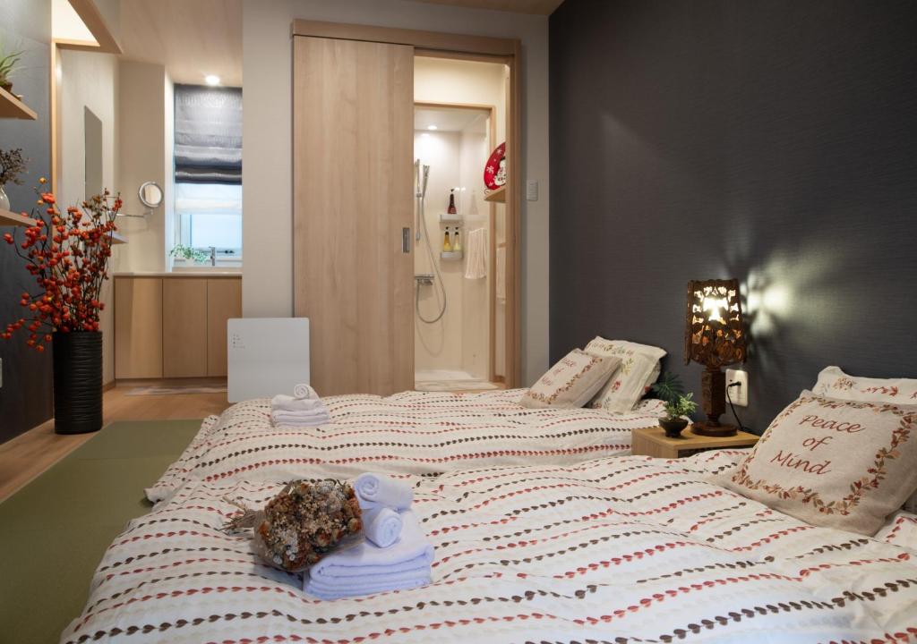 Postel nebo postele na pokoji v ubytování Miidokoro House Hotel