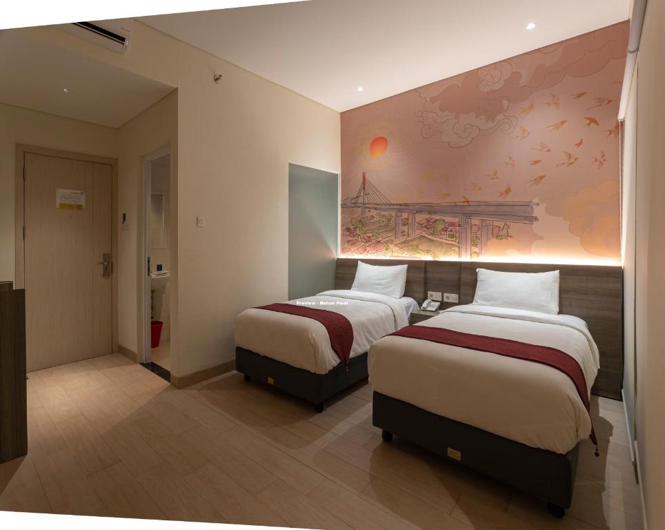 Postel nebo postele na pokoji v ubytování Hotel 88 Alun Alun Bandung By WH