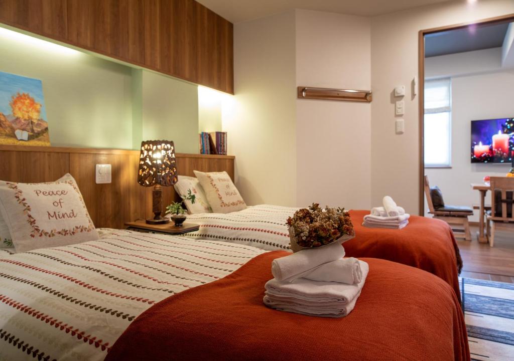 Postel nebo postele na pokoji v ubytování Miidokoro House Hotel
