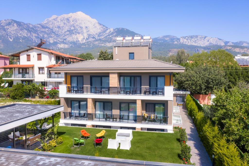 a house with a view of the mountains at Orion Apart Tekirova in Kemer