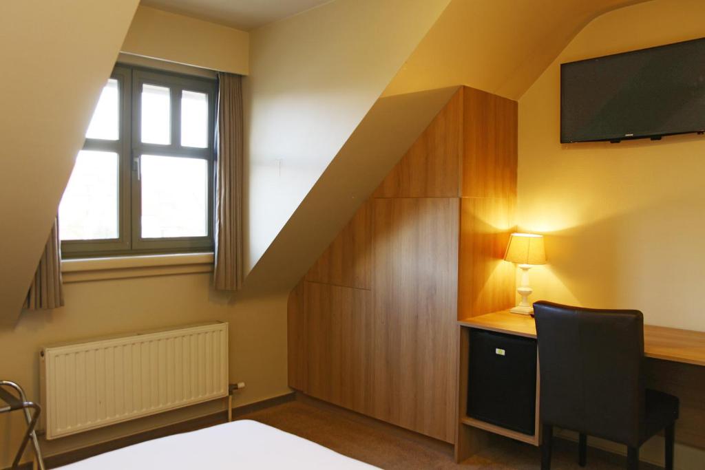 TV a/nebo společenská místnost v ubytování Hotel Les Dunes