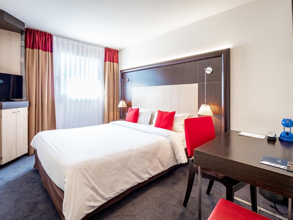 Postel nebo postele na pokoji v ubytování Hôtel de Bonlieu