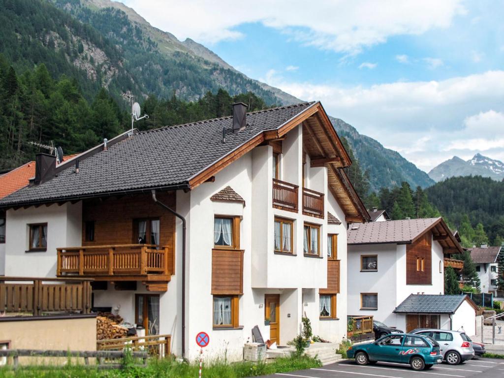 a building with a car parked in front of it at Apartment Lore - SOE 301 by Interhome in Sölden
