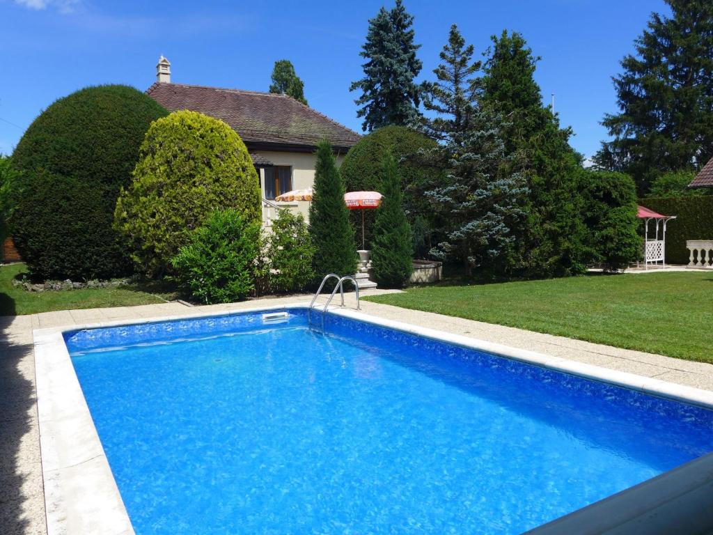 a swimming pool in the yard of a house at Holiday Home 5- chemin de la Pralay by Interhome in Bellevue