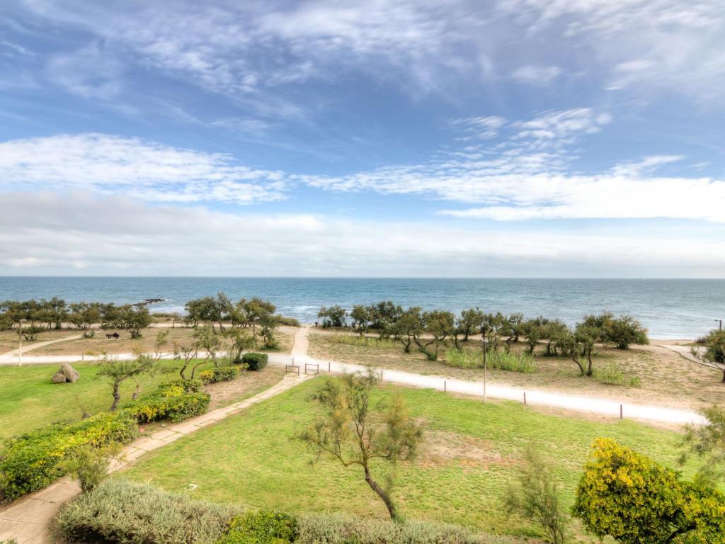 a view of the beach and the ocean at Apartment De La Plage-3 by Interhome in Cap d'Agde