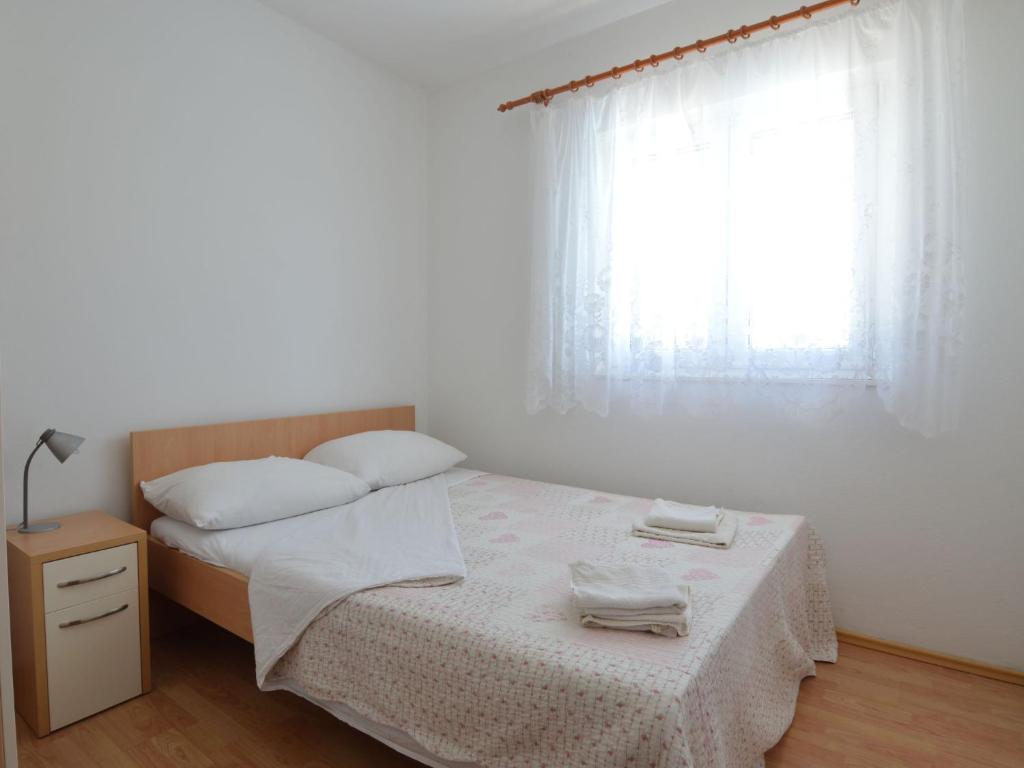 Posteľ alebo postele v izbe v ubytovaní Holiday Home Basic by Interhome