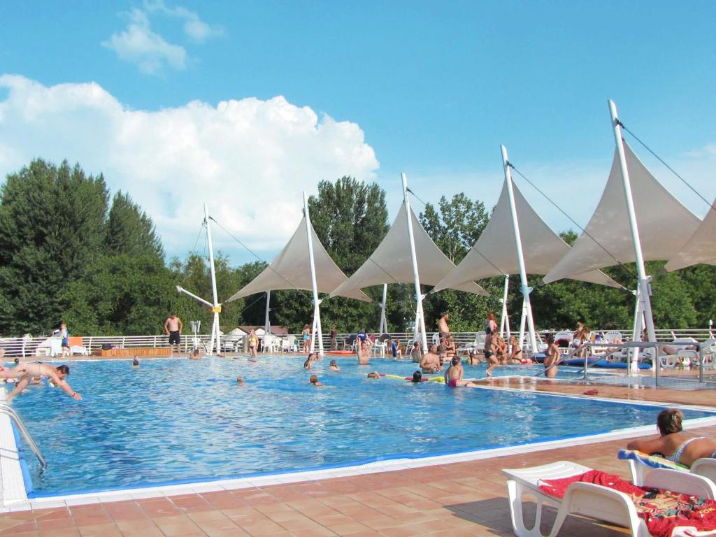 a large swimming pool with many people in it at Holiday Home Balatontourist Füred-1 by Interhome in Balatonfüred