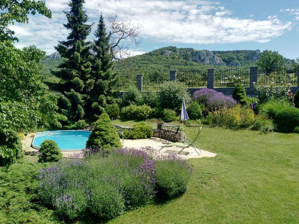 a garden with a swimming pool and flowers at Holiday Home Horní Věstonice by Interhome in Horní Věstonice