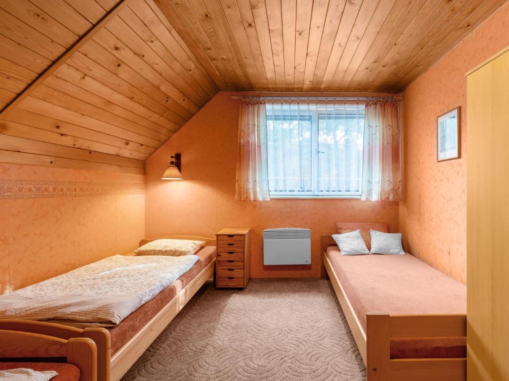 Postel nebo postele na pokoji v ubytování Holiday Home Horní Věstonice by Interhome