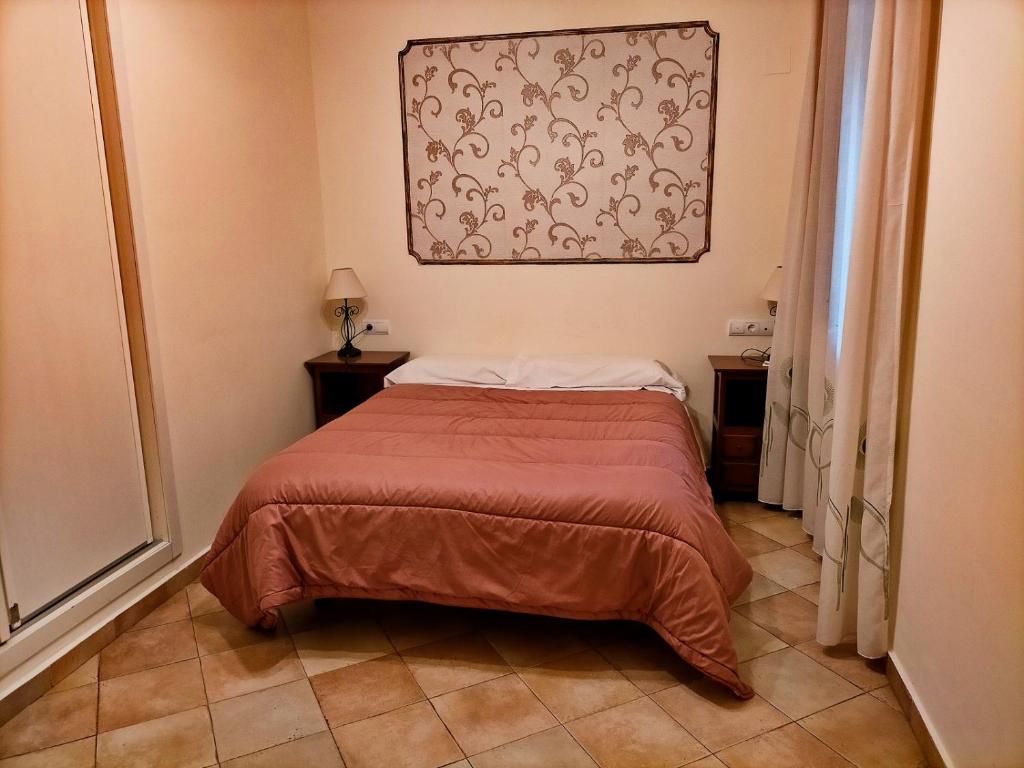 Postel nebo postele na pokoji v ubytování Abadia Suites