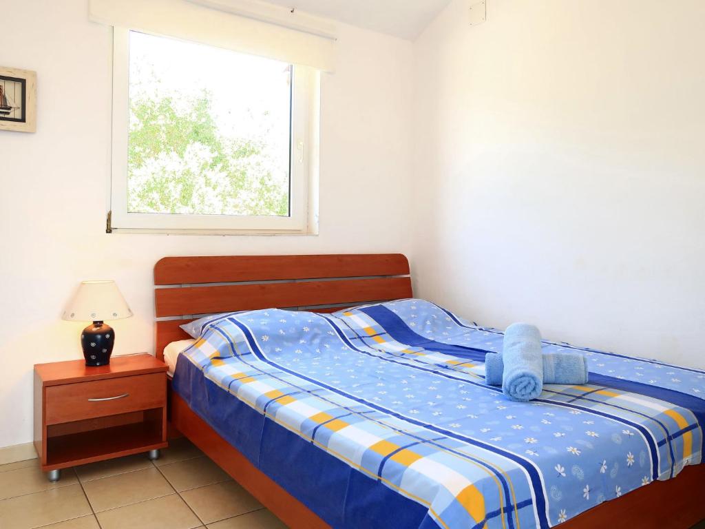 Postel nebo postele na pokoji v ubytování Apartment Andrea-1 by Interhome
