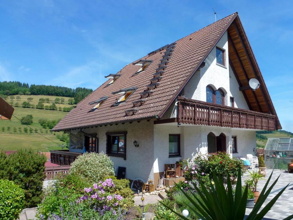 a house with a brown roof at Apartment Pension Himmelsbach by Interhome in Welschensteinach