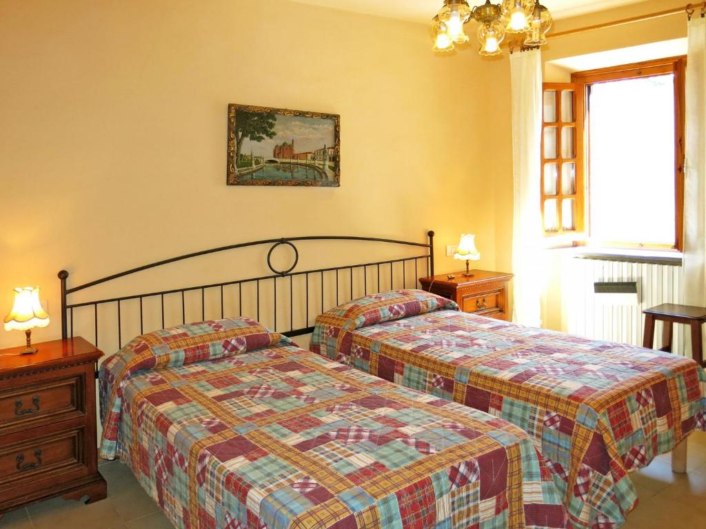 Łóżko lub łóżka w pokoju w obiekcie Holiday Home Castagni II - OCT101 by Interhome