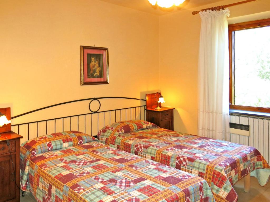 Łóżko lub łóżka w pokoju w obiekcie Holiday Home Castagni II - OCT101 by Interhome