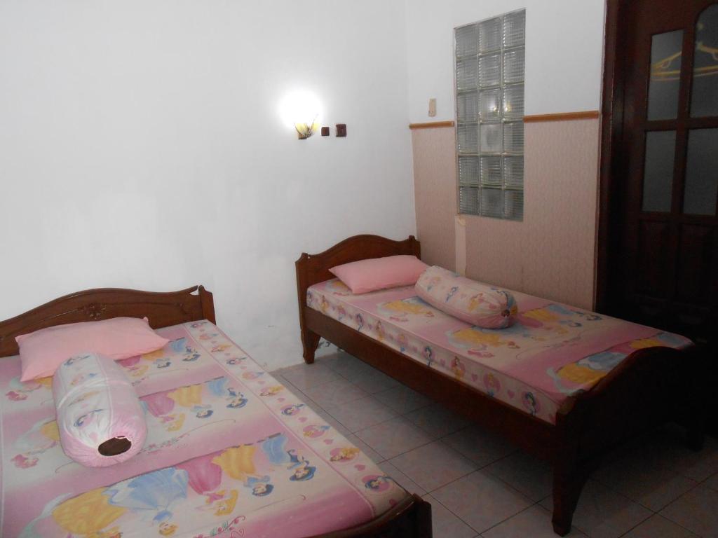 Postel nebo postele na pokoji v ubytování Fortuna Guest House