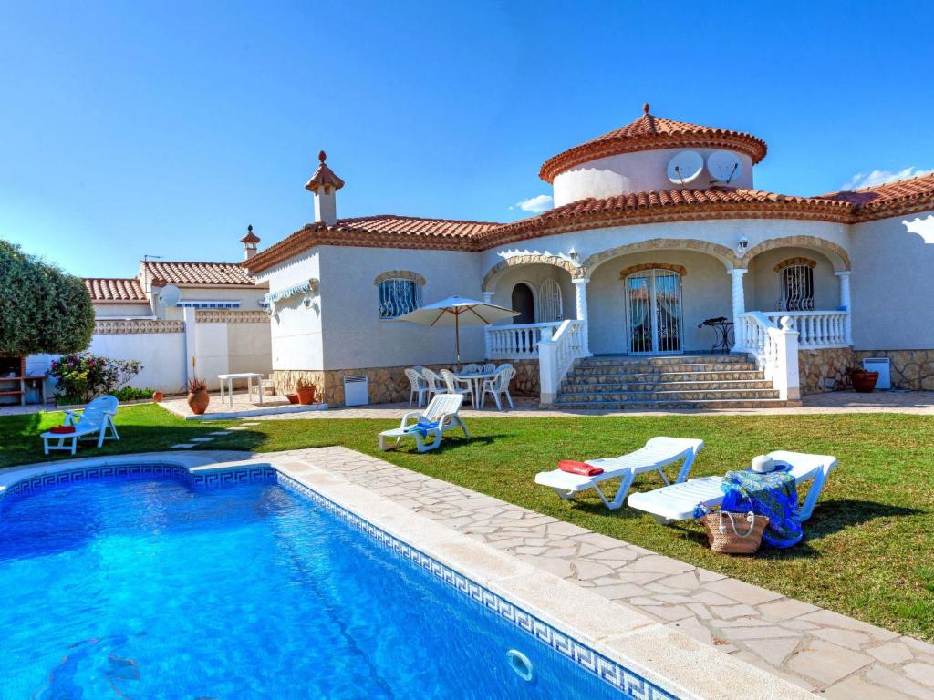 a house with a swimming pool in front of it at Villa Villa Mys by Interhome in Miami Platja