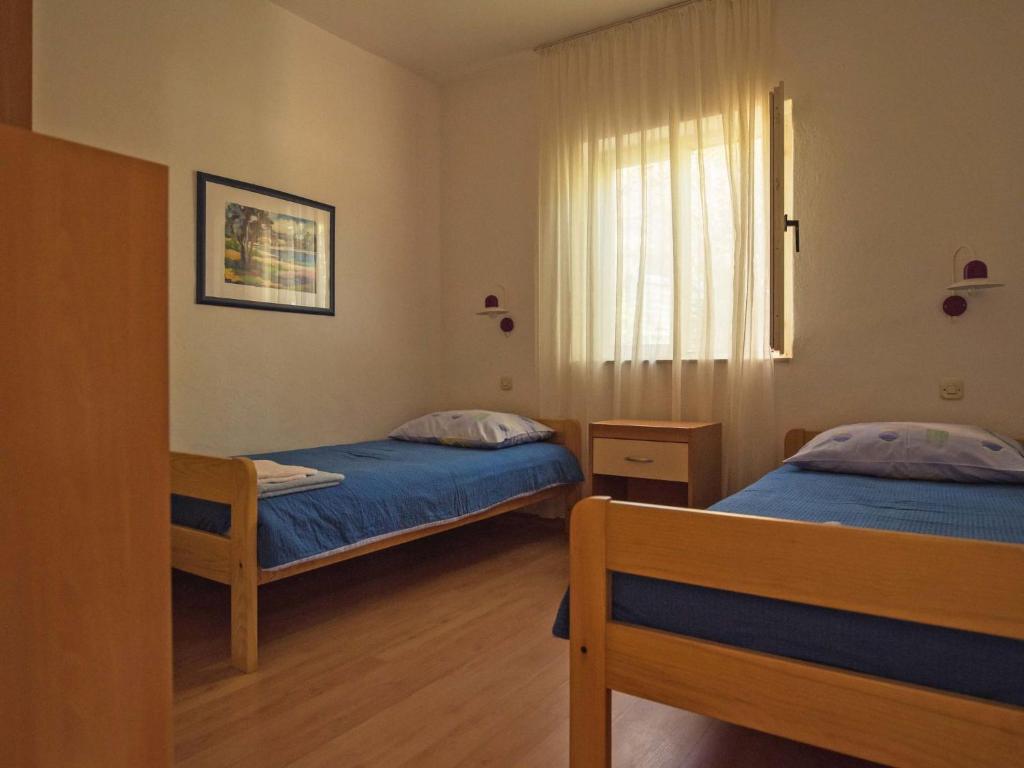 Postel nebo postele na pokoji v ubytování Holiday Home Dada by Interhome